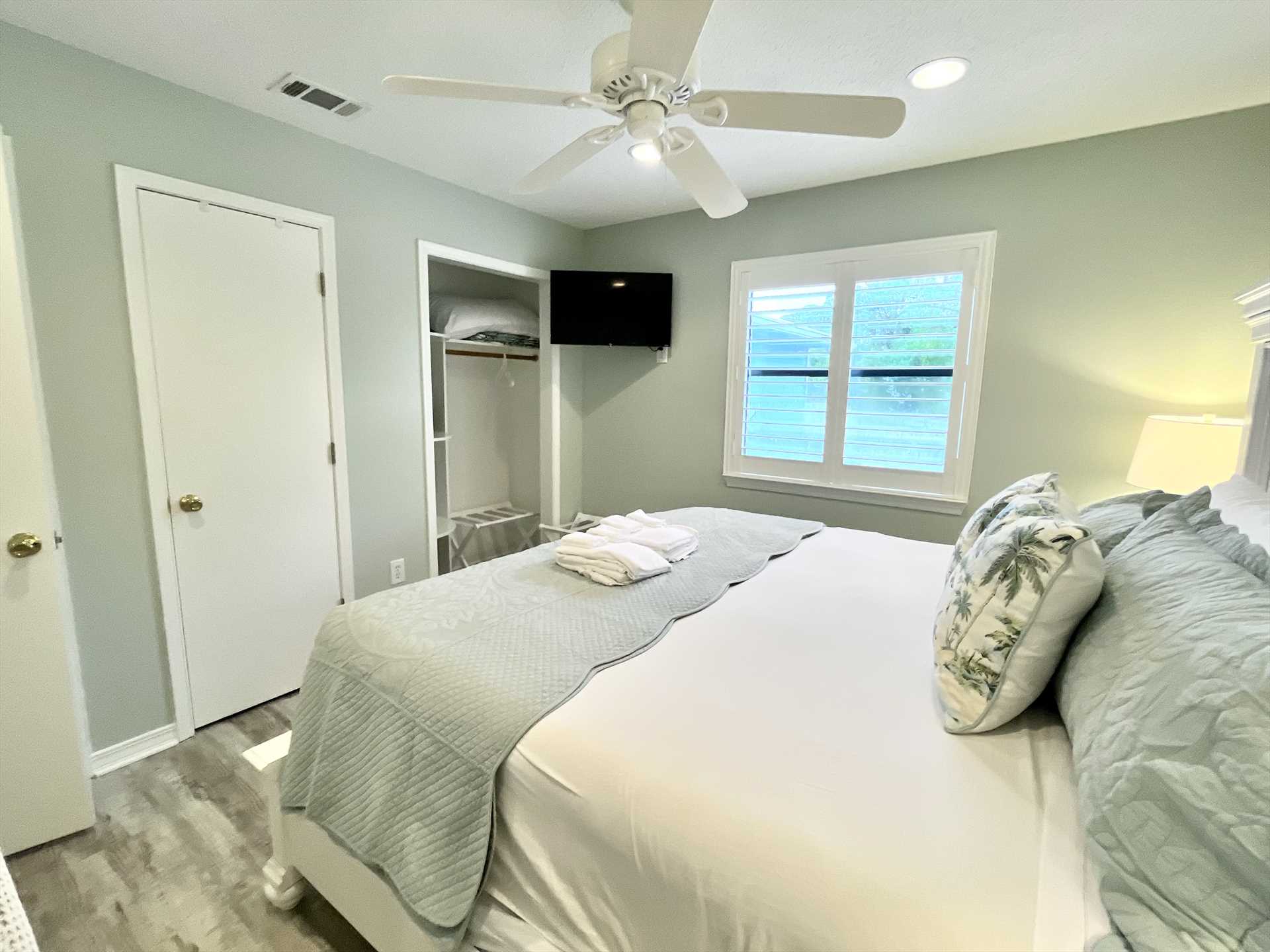 The second bedroom with closet and dresser for storage.