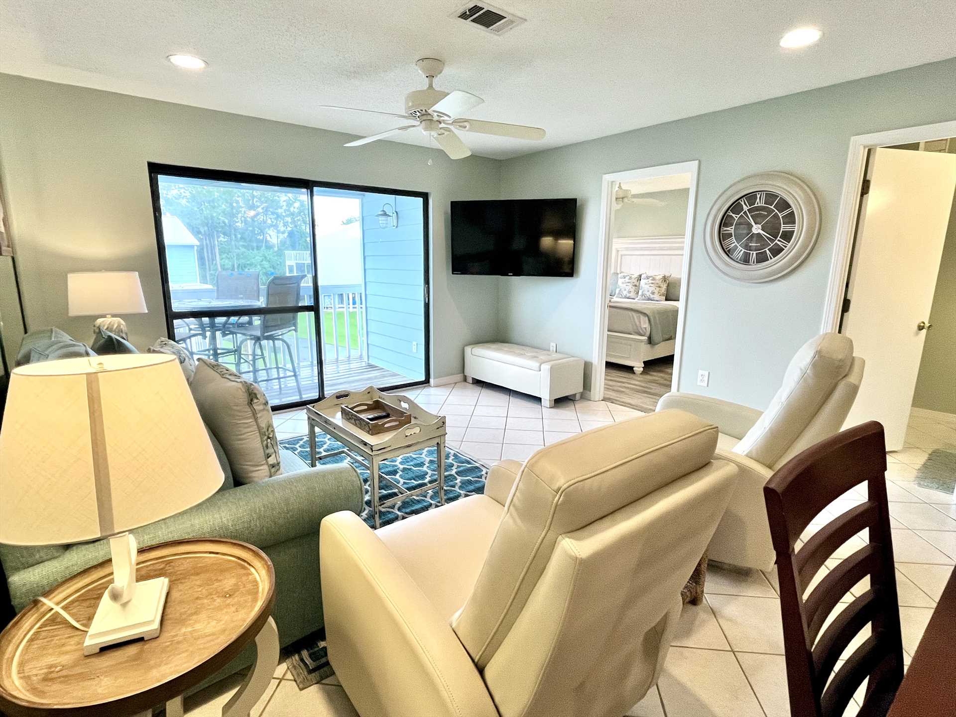 The large glass sliding door takes center stage in the livin