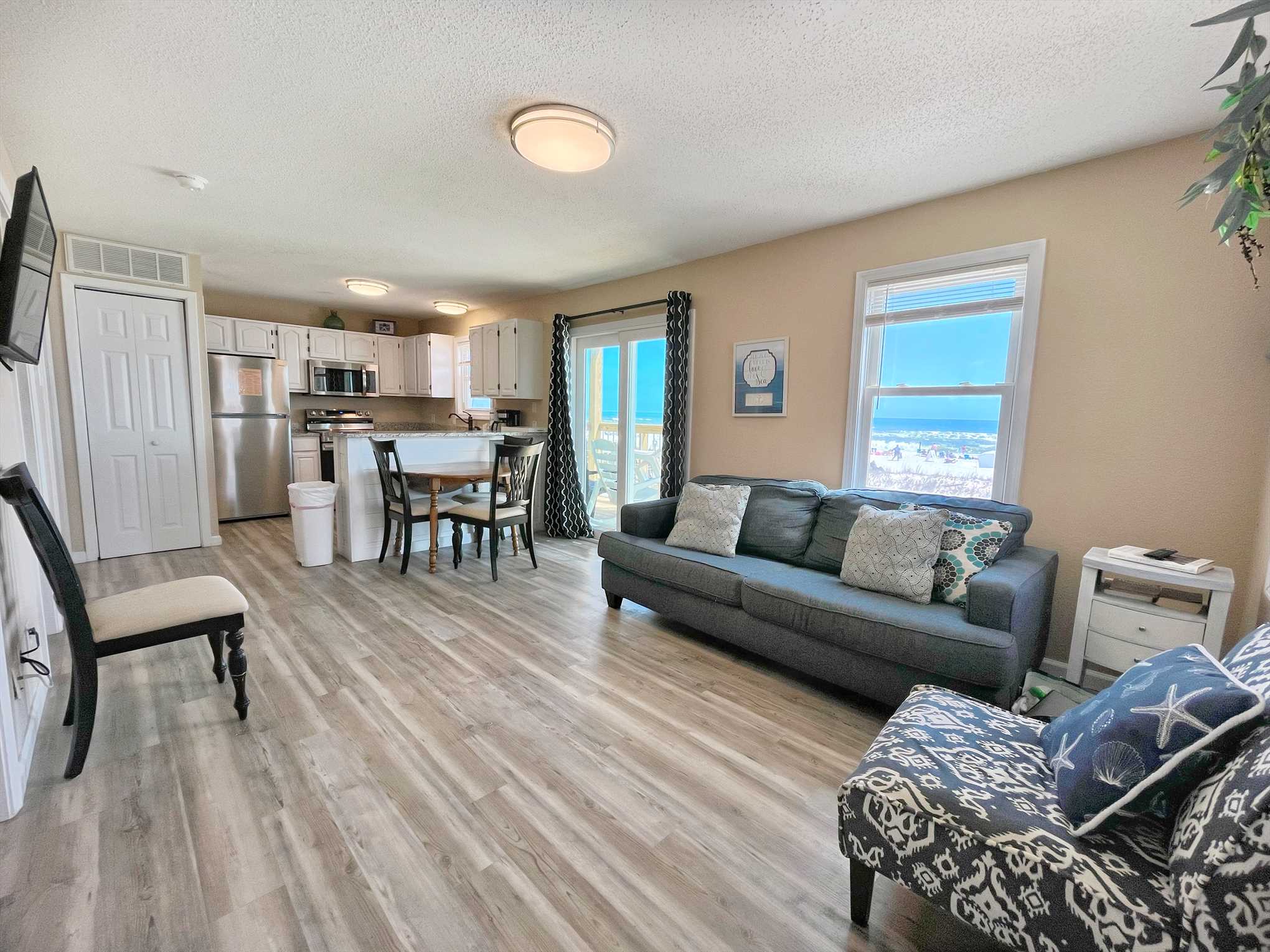 The living room includes a large, Smart TV to stream your fa