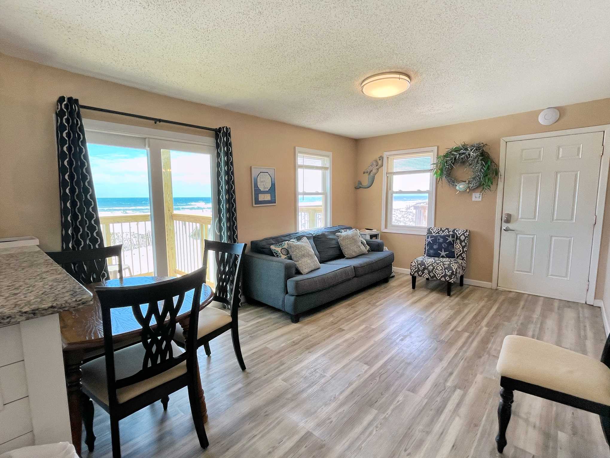 Open living room with direct access to private balcony.