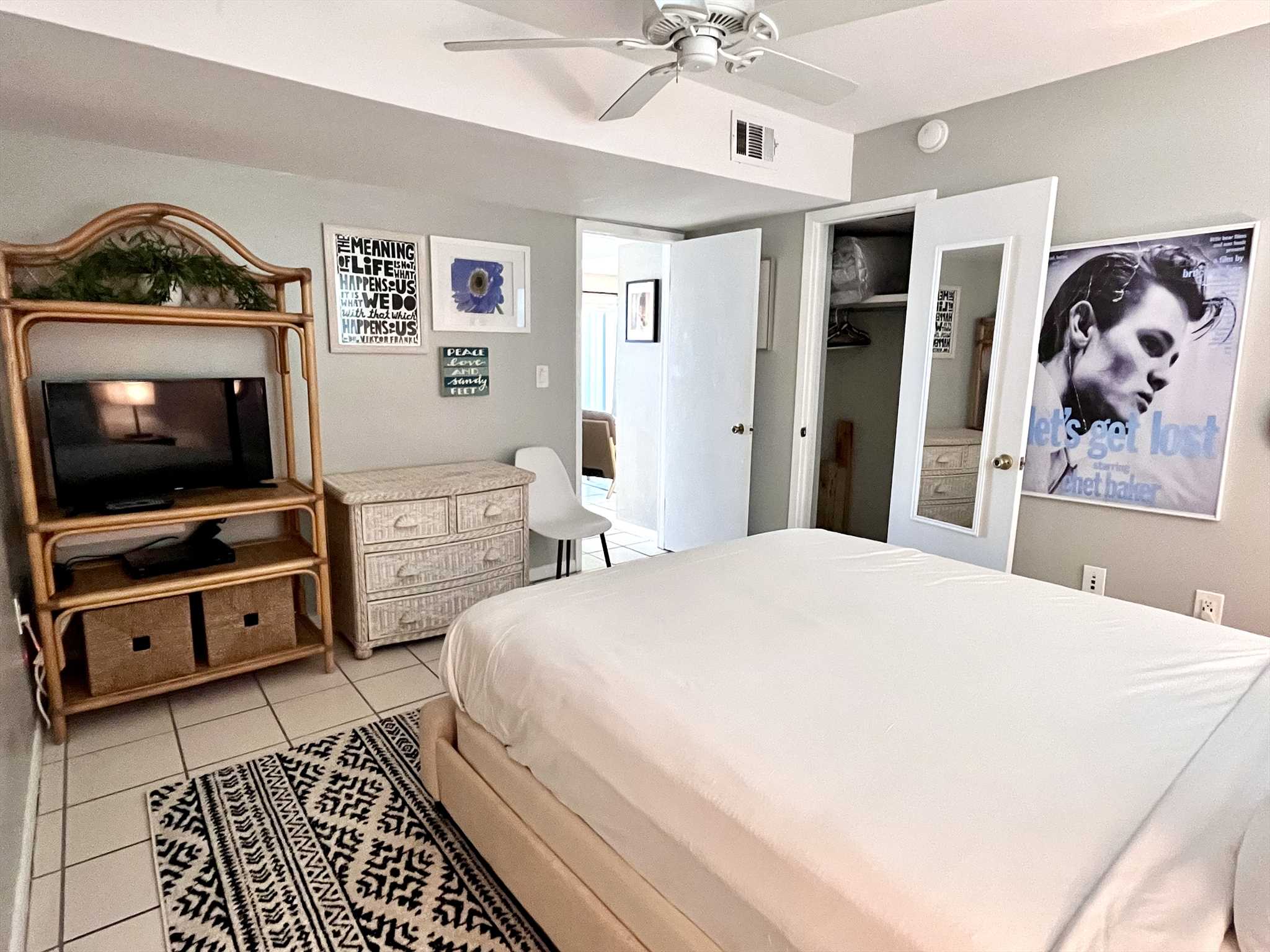 The remodeled bathroom includes a tiled enclosure and upgrad