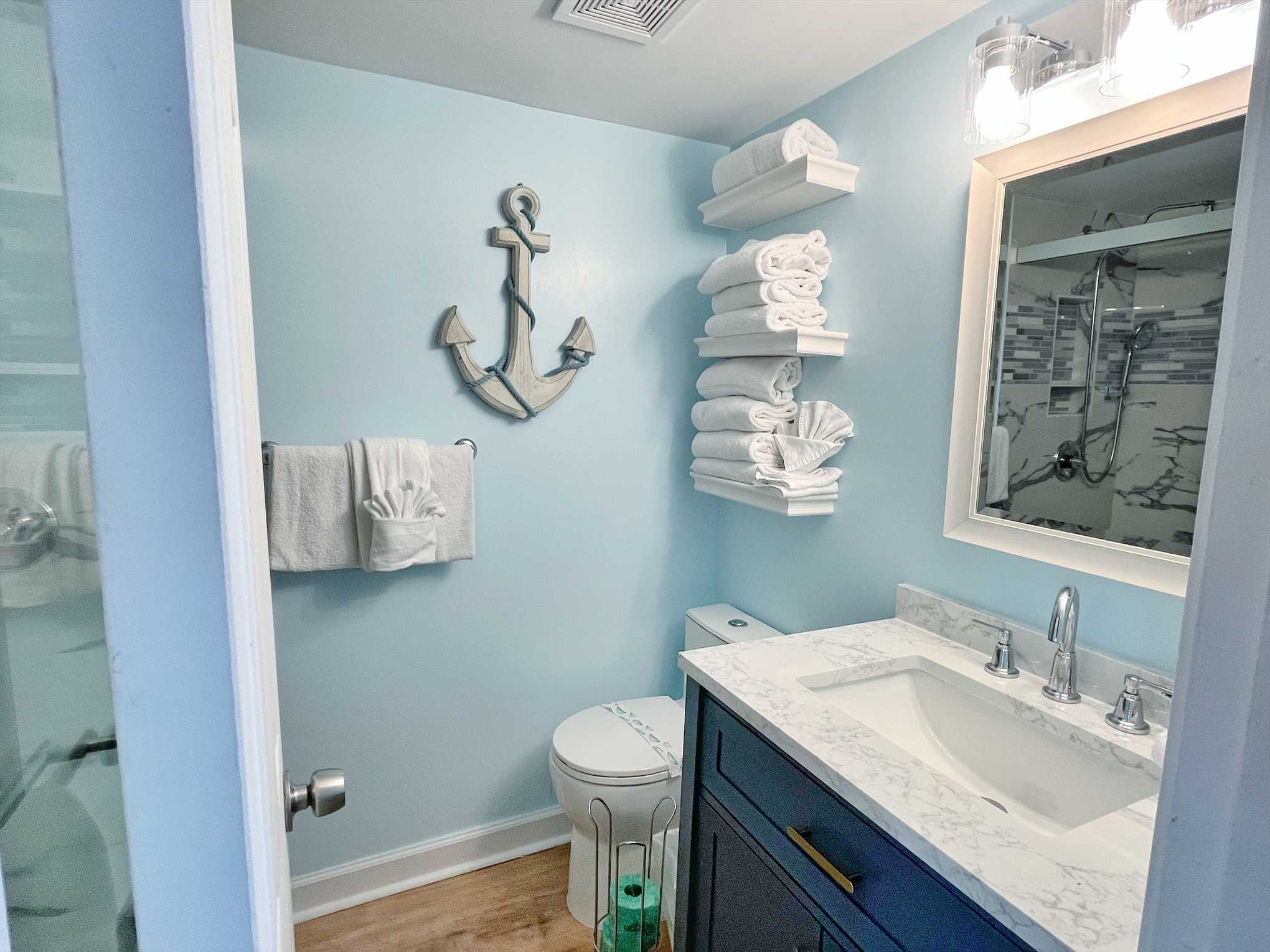 The bathroom includes bath towels and a start up supply of m