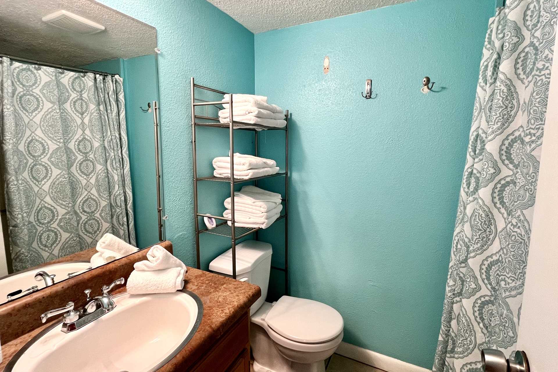 The bathroom is small and includes a shower/tub combo.  Bath