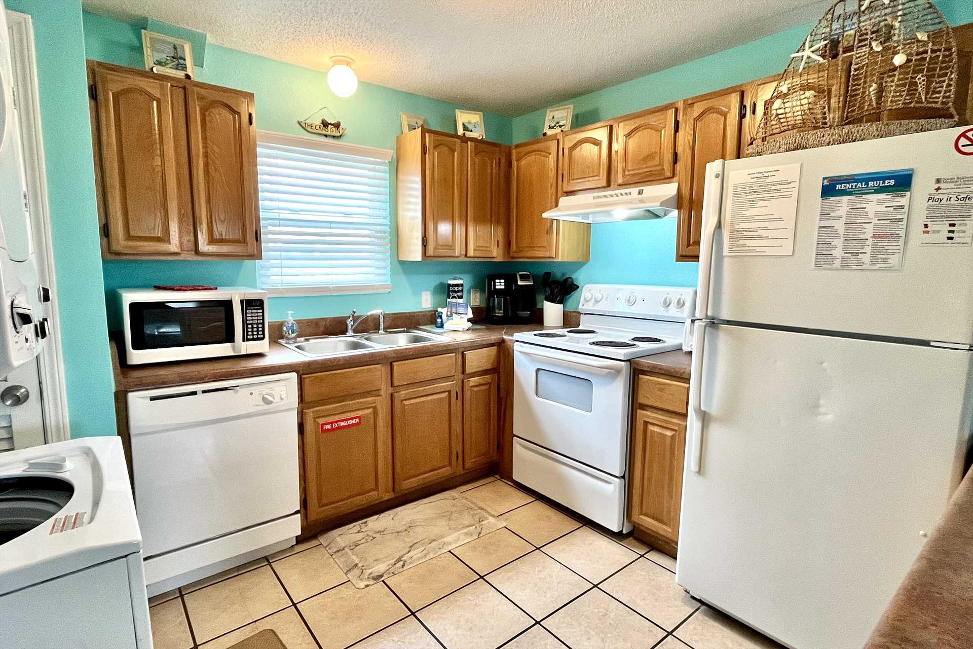 Full kitchen with appliances and stocked with essentials in 