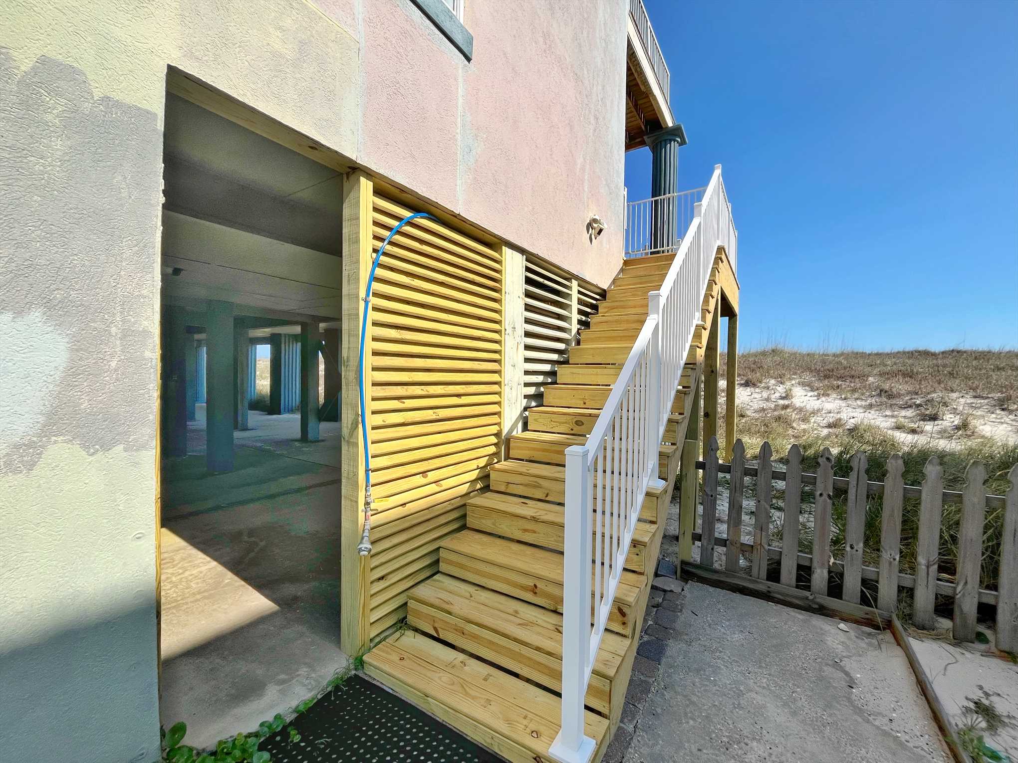 Newly rebuilt exterior staircase and rinse shower.