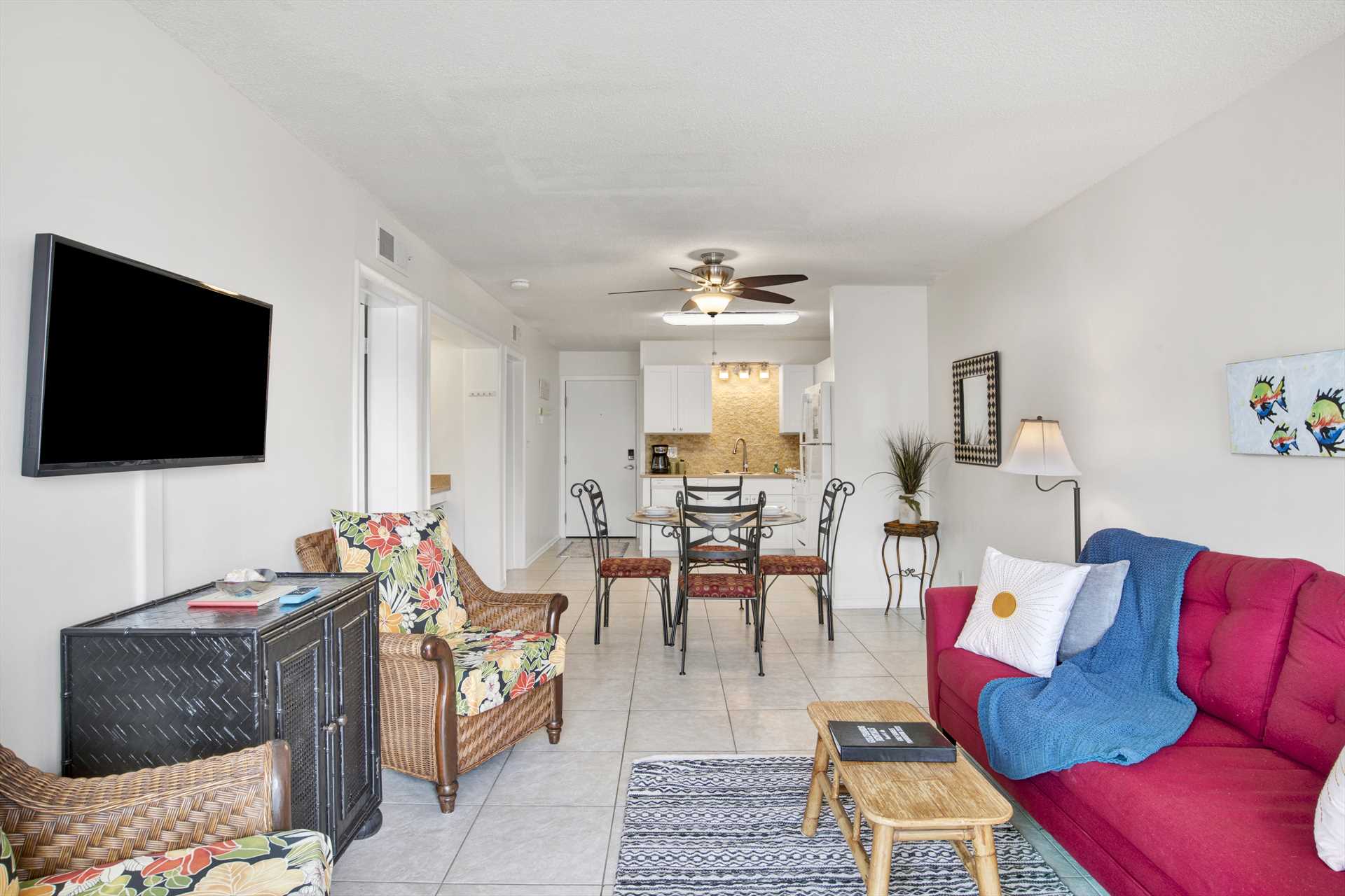 Living room flat screen cable TV plus additional seating.