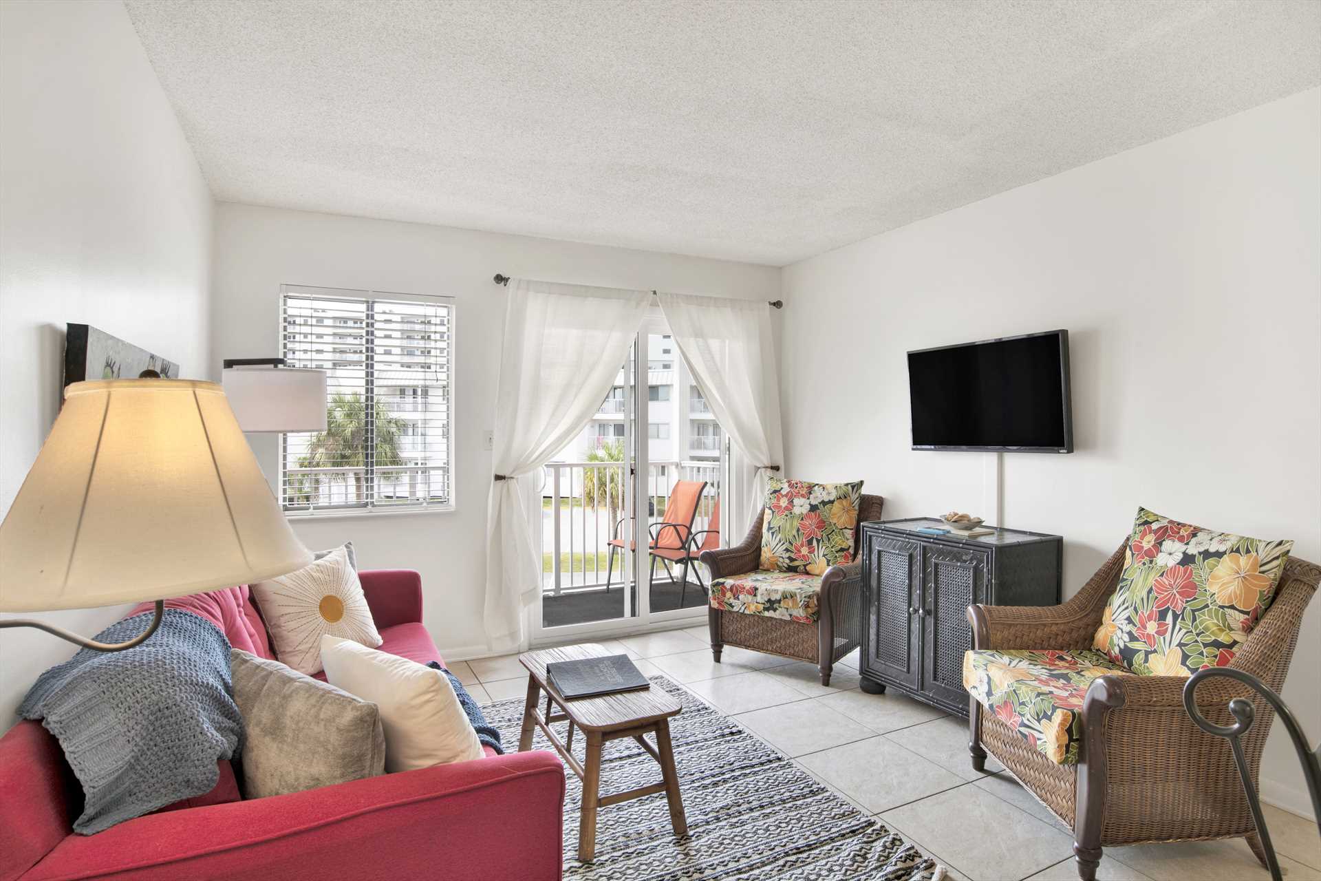 Cozy living room with direct access to the private balcony.