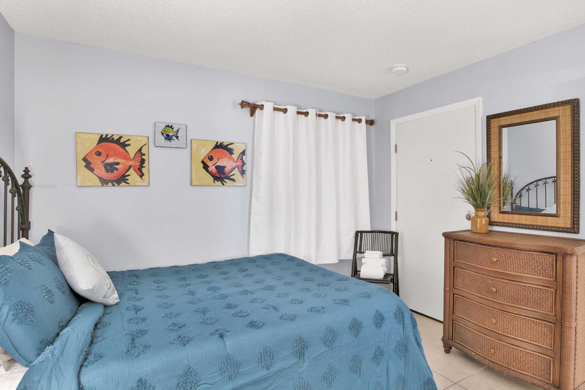 The second bedroom includes a queen-sized bed and closet for