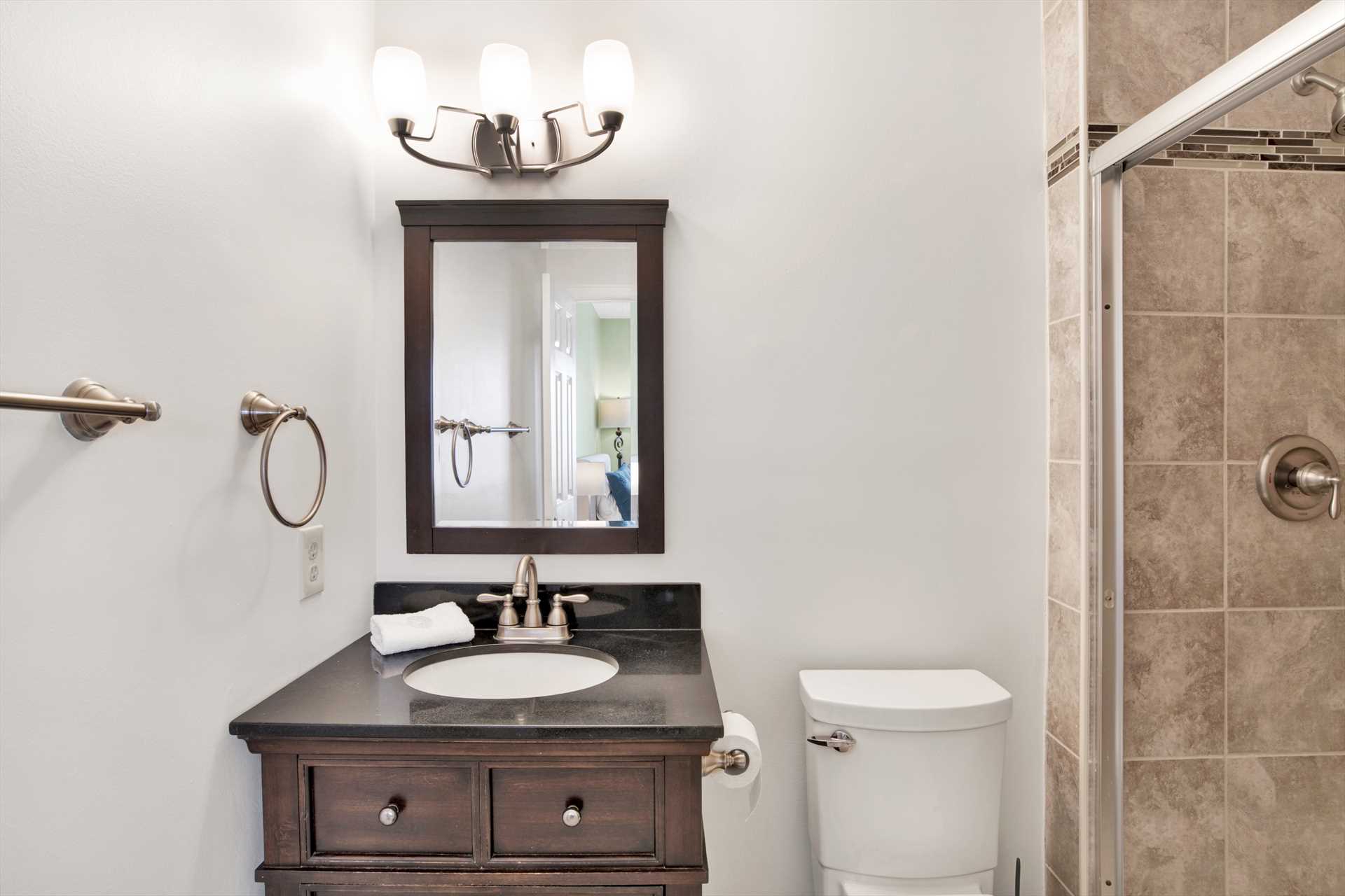 Renovated bathroom with updated plumbing and vanity.