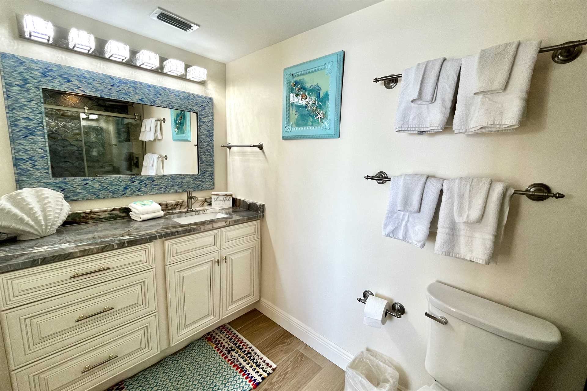The master bathroom includes a large vanity with plenty of c