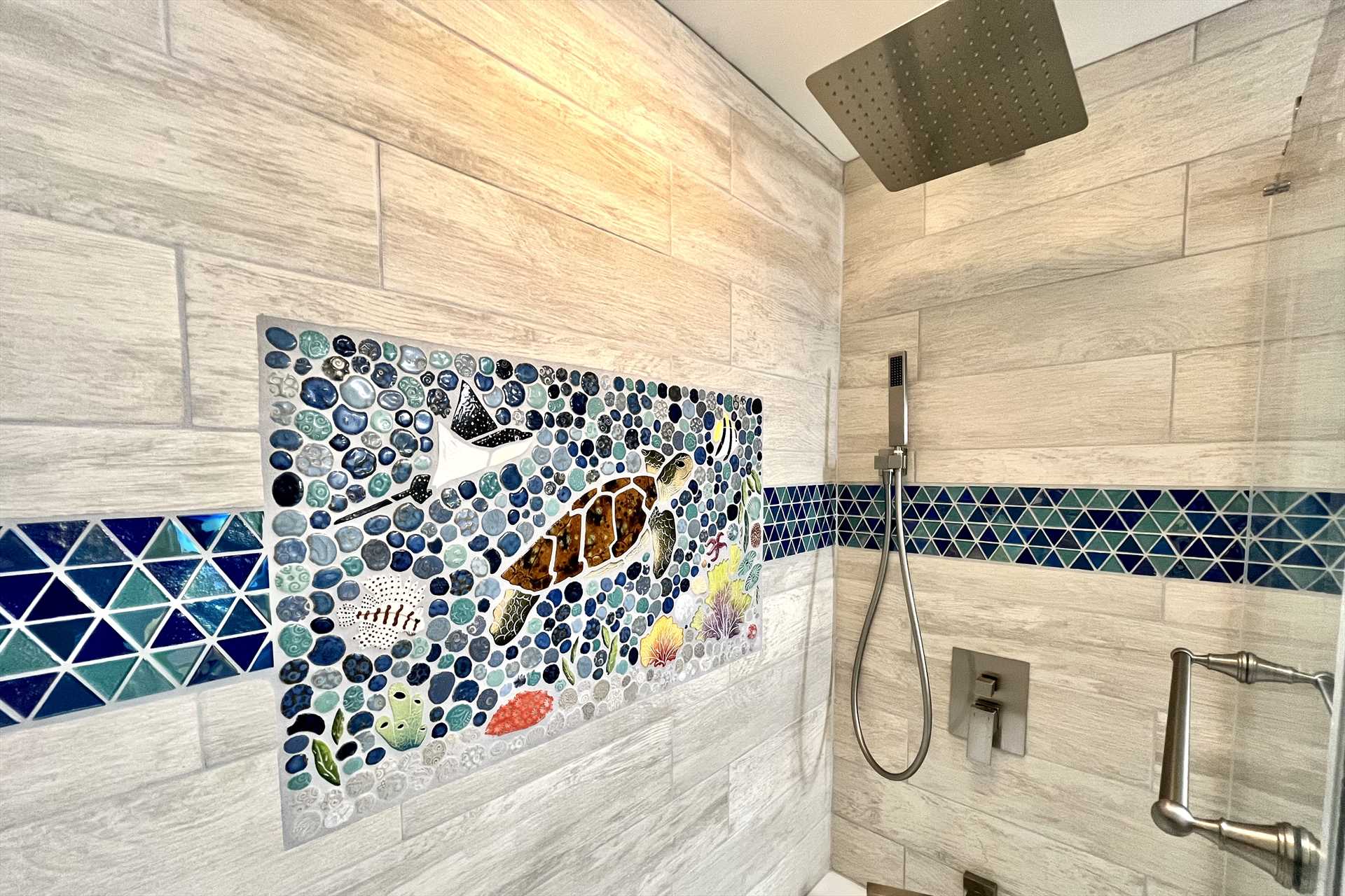 Check out the mosaic and nice shower fixtures.