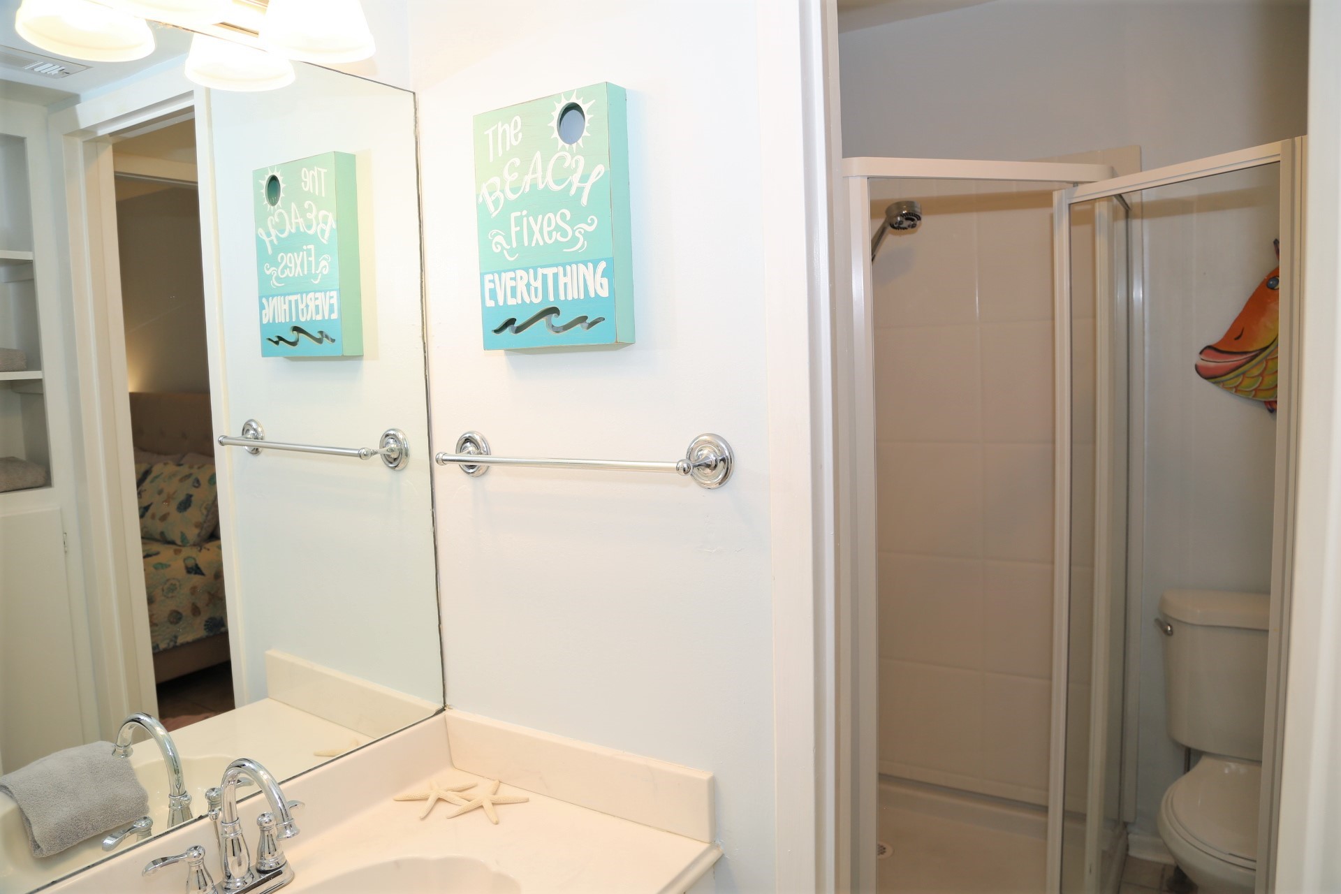 The downstairs bathroom with vanity and stall shower.