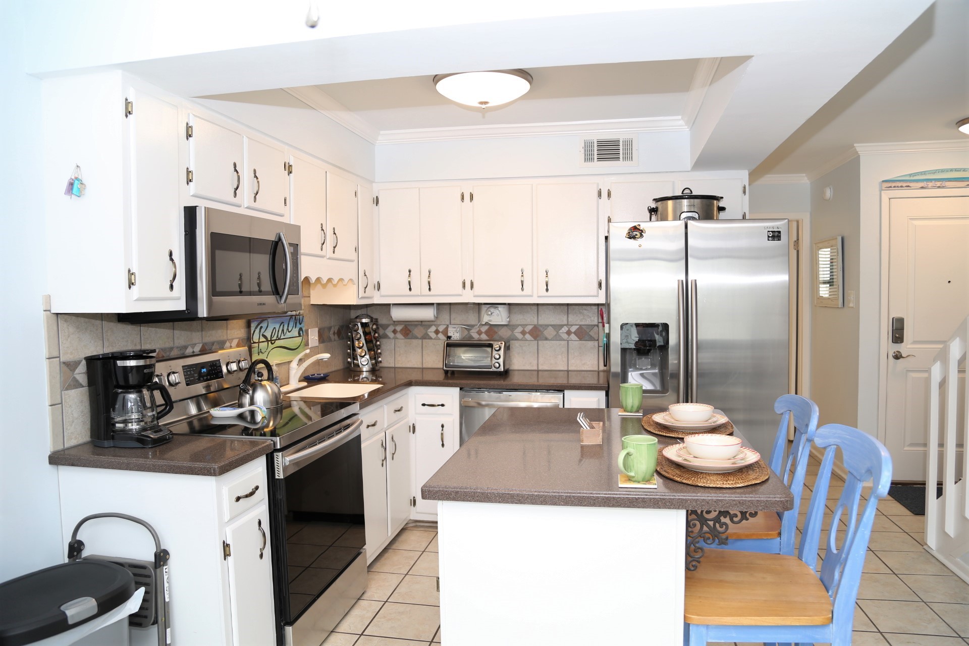 Fully equipped kitchen with updated appliances.