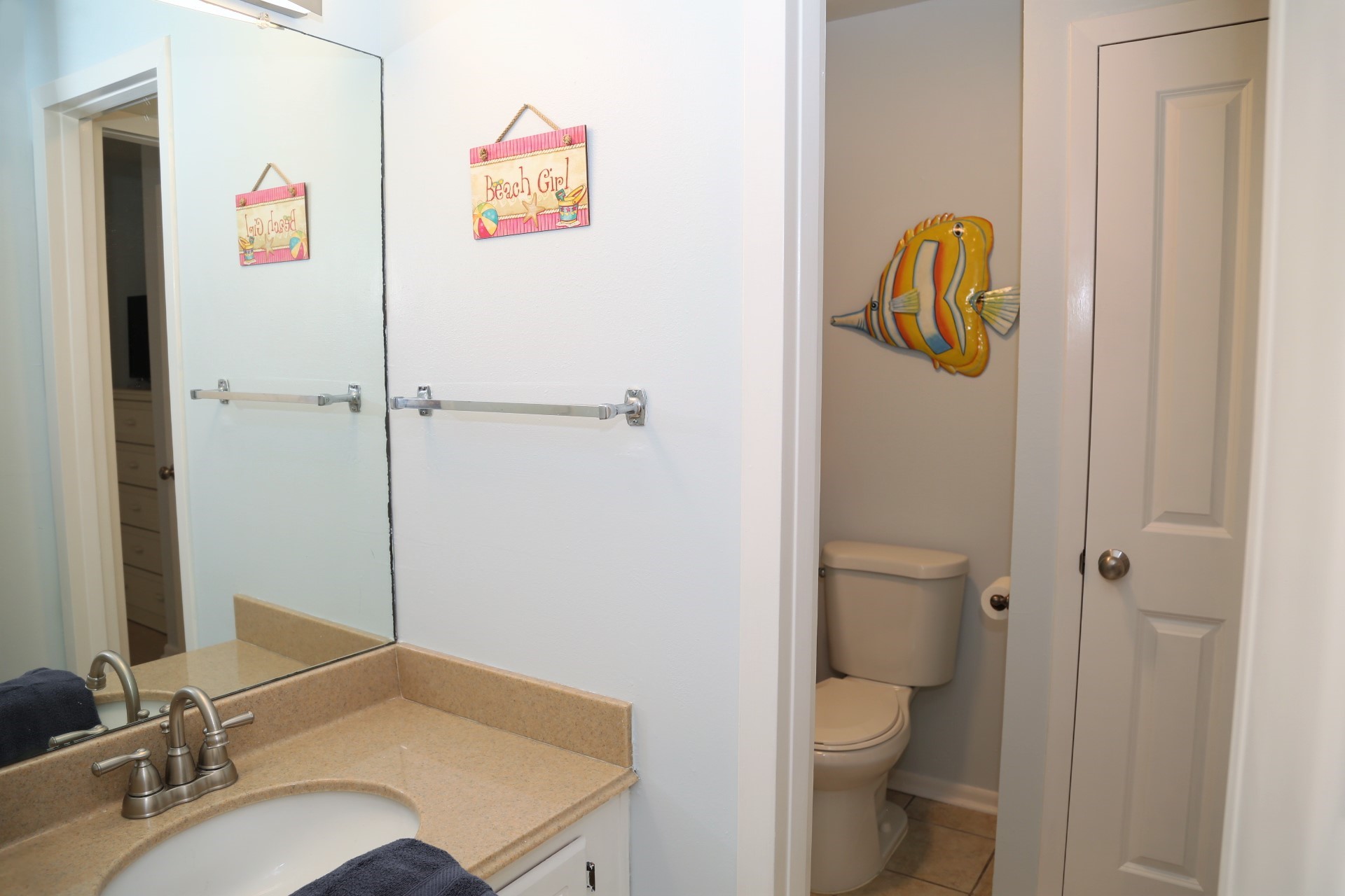 The upstairs bathroom vanity with separate shower/tub.
