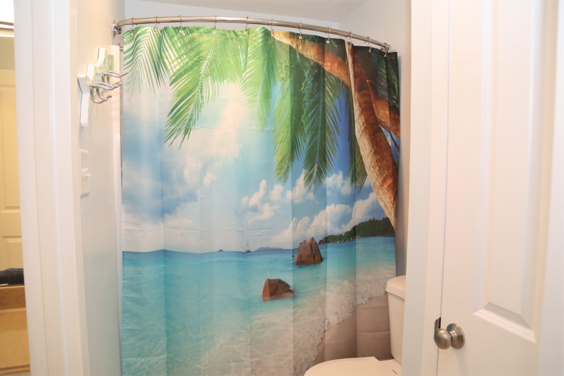 Upstairs on-suite bathroom with shower/tub combo located btw