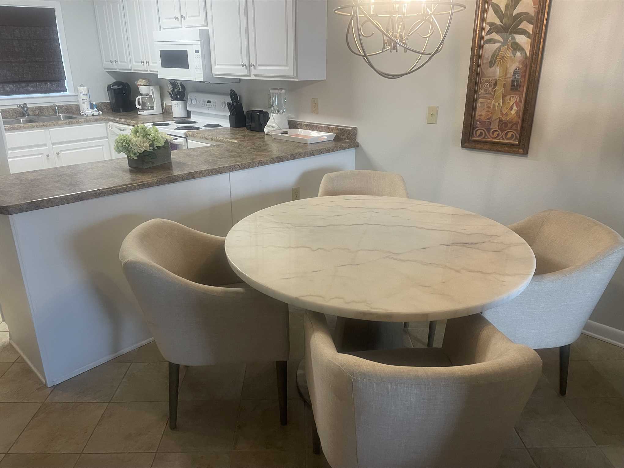 The kitchen includes plenty of counter space for prepping me
