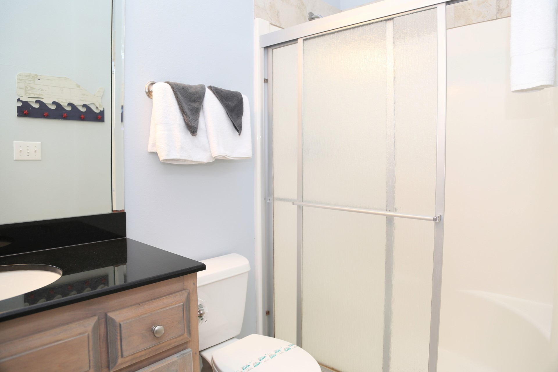 The en-suite bathroom with shower (no tub) located in the Qu
