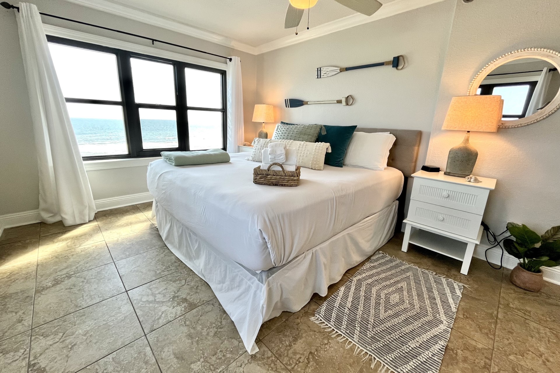 The main bedroom includes a king-size bed and corner views