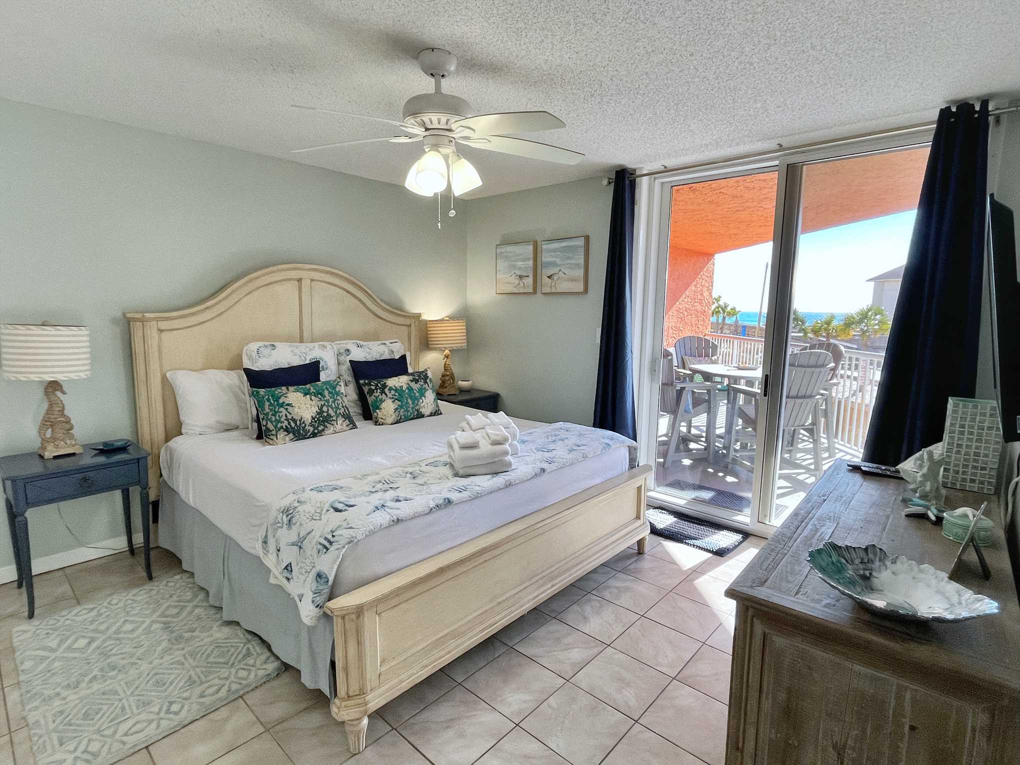 The primary bedroom includes a king size bed.