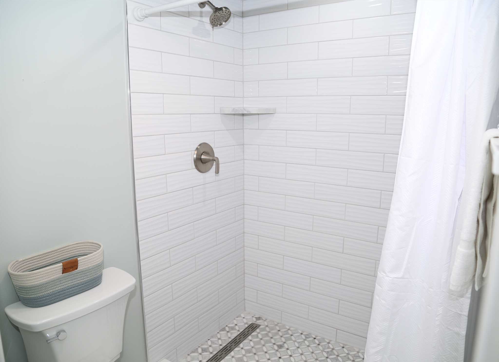 Step in and enjoy a spa-like shower in the fully remodeled p