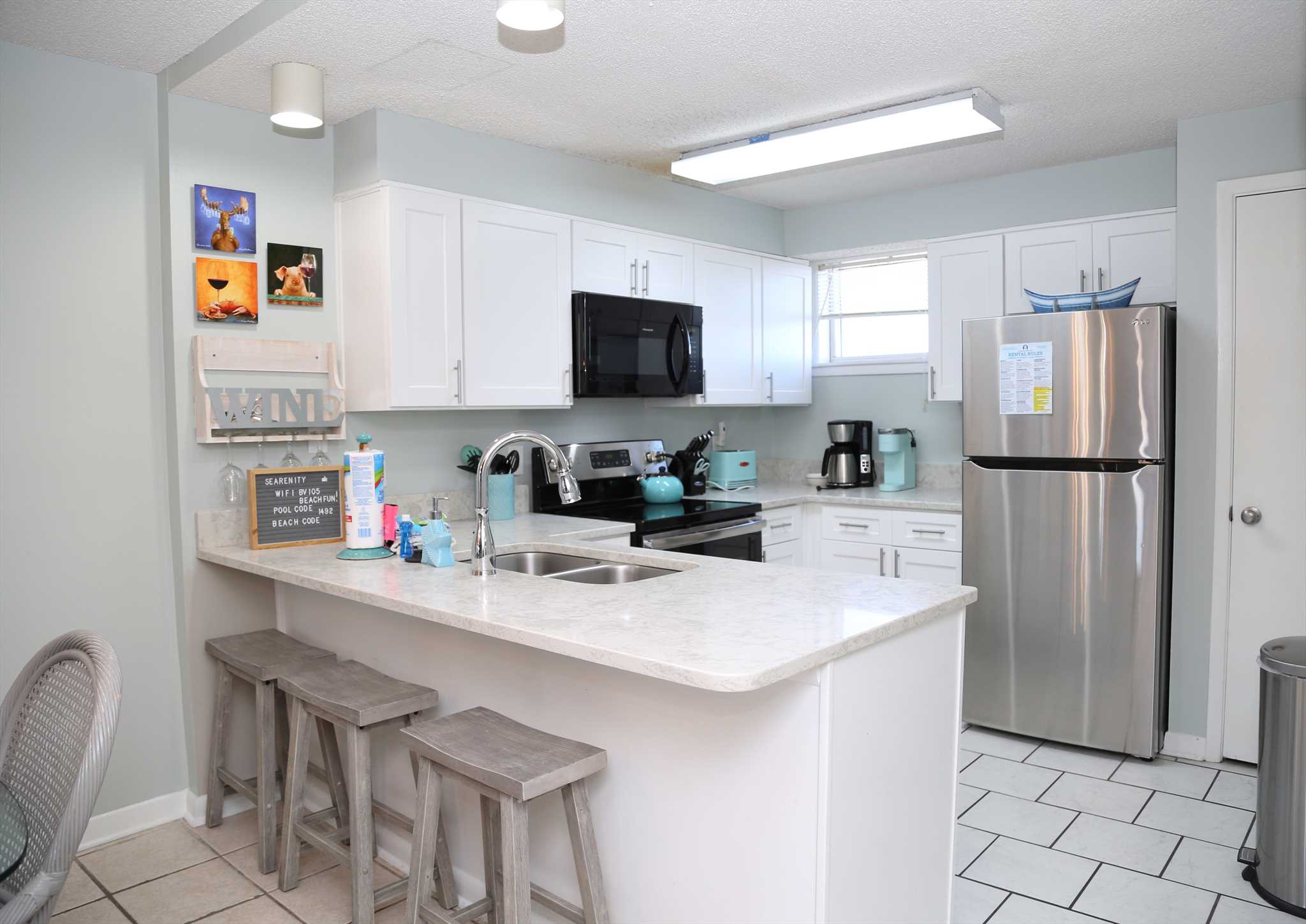 The fully equipped kitchen is stocked with everything you ne