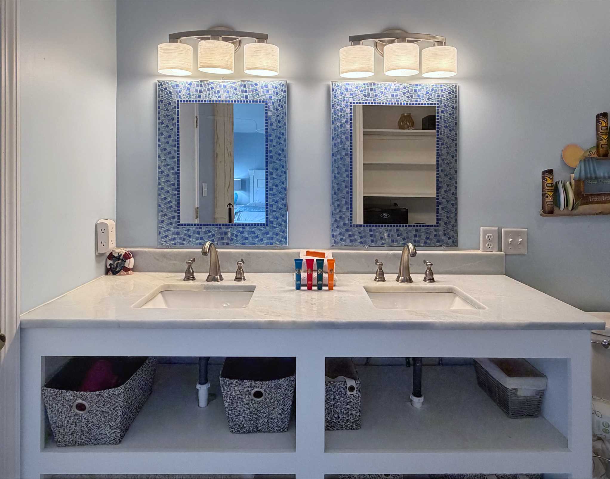 The ensuite bathroom with a beautifully tiled tub surround.