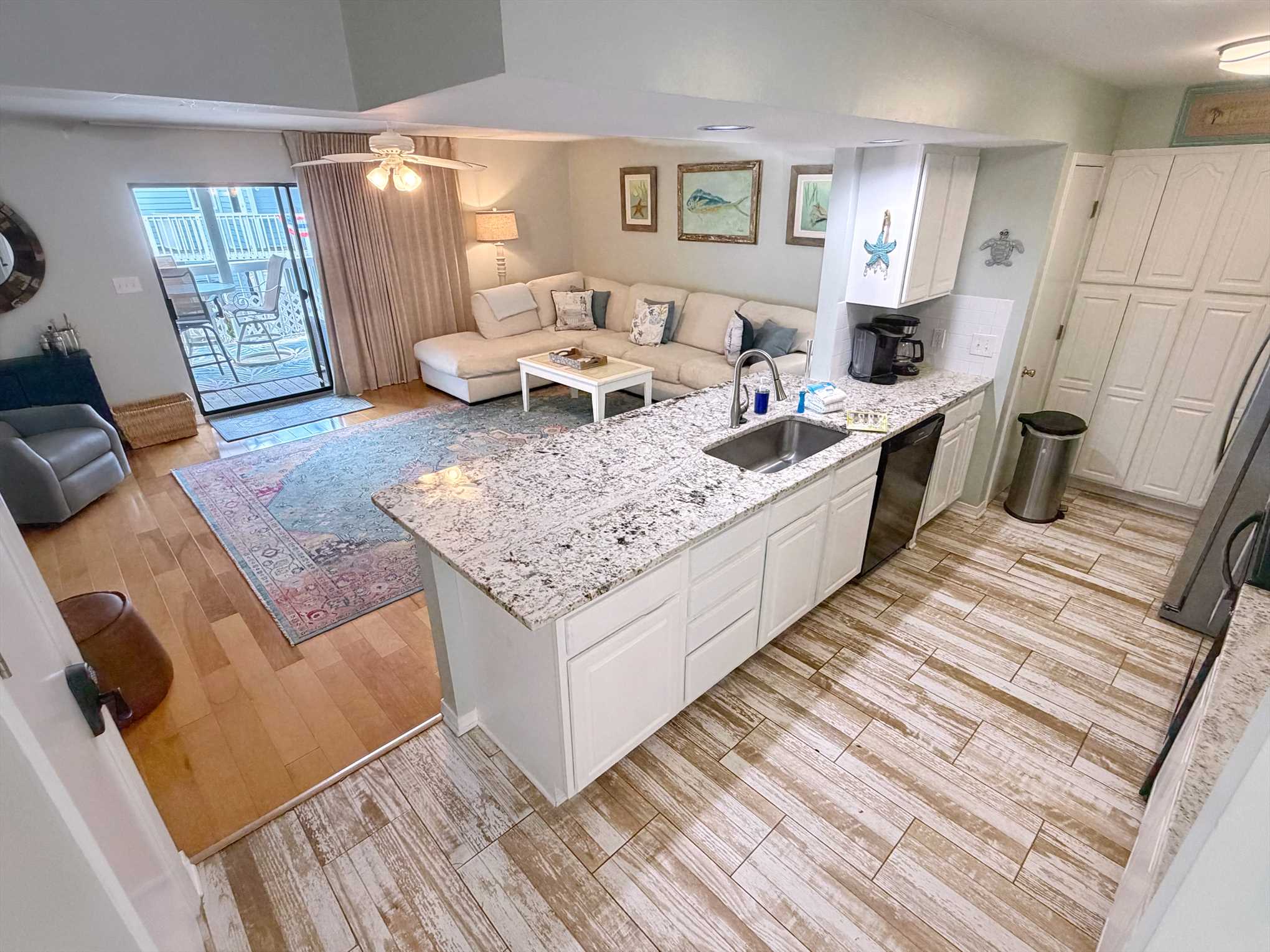 The large glass sliding door takes center stage in the livin