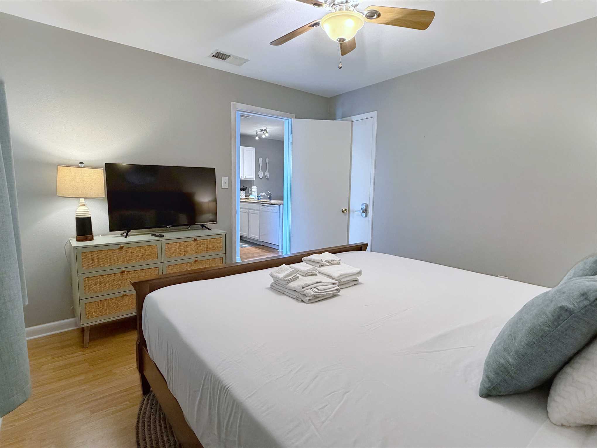 The guest bedroom includes a dresser for storage and a Smart