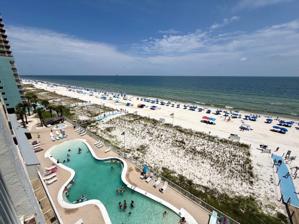 Families enjoying an August beach vacation in Gulf Shores, Alabama