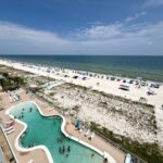 Families enjoying an August beach vacation in Gulf Shores, Alabama